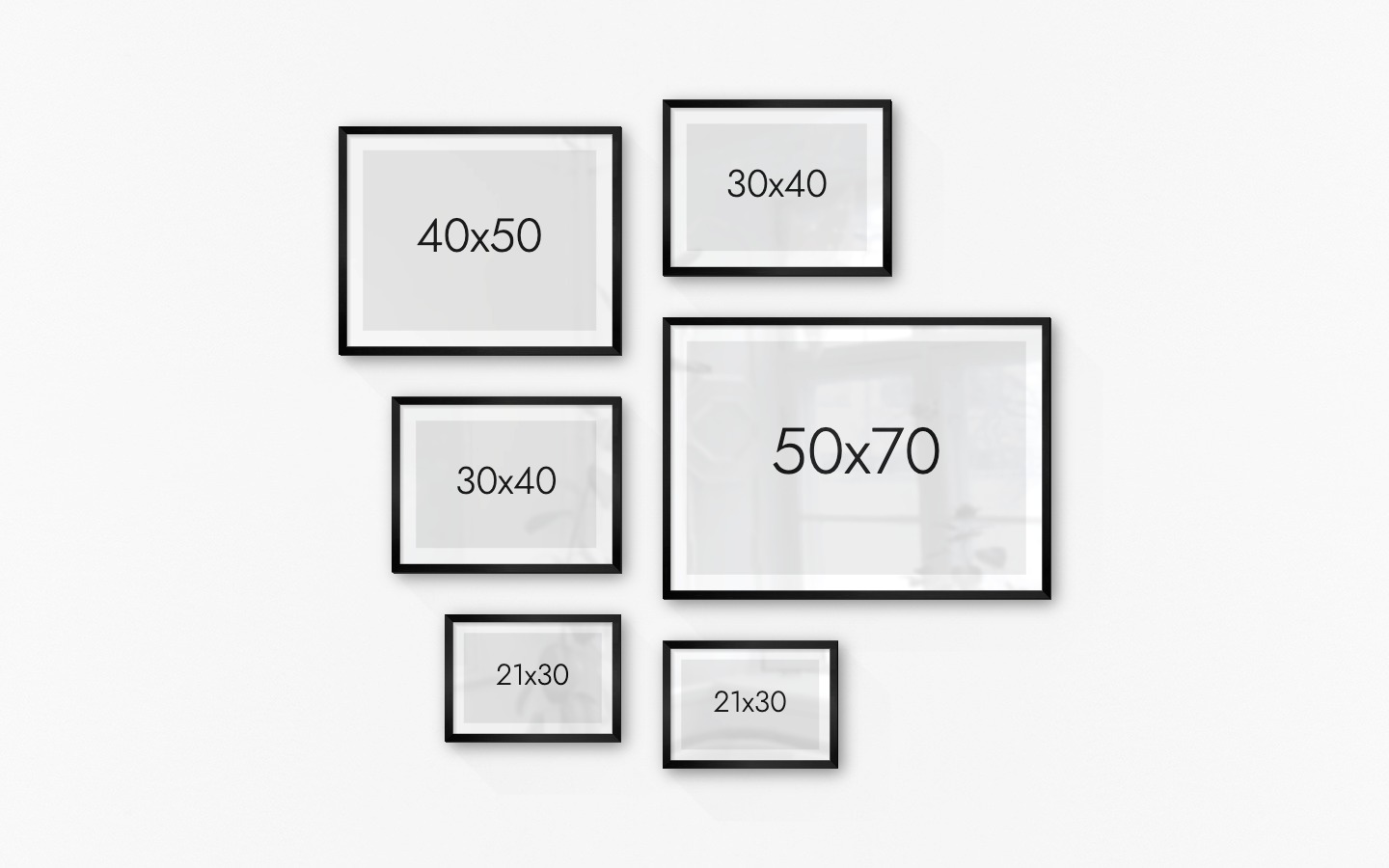 Tavelvägg med ramar i svart i storlekar 40x50, 30x40, 21x30 och 50x70